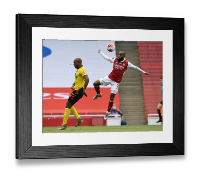 Framed Print : Lacazette vs. Kabasele: A Premier League Battle at Arsenal's Emirates Stadium