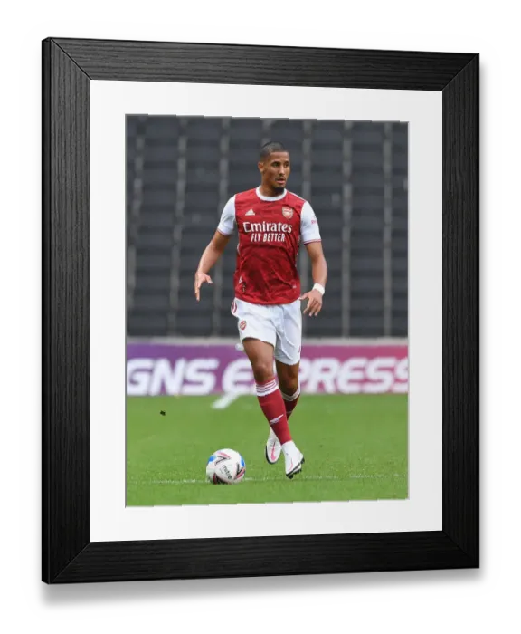 Framed Print : William Saliba Shines: Arsenal Dominate MK Dons in Pre-Season Friendly Framed Print : William Saliba Shines: Arsenal Dominate MK Dons in Pre-Season Friendly