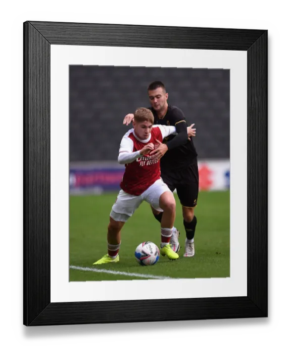 Framed Print : Arsenal's Emile Smith Rowe Faces Off Against MK Dons Daniel Harvie in 2020-21 Pre-Season Friendly