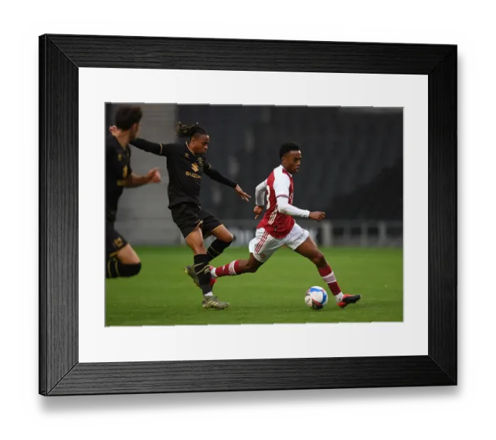 Framed Print : Arsenal's Joe Willock Goes Head-to-Head with MK Dons David Kasumu in Pre-Season Clash Framed Print : Arsenal's Joe Willock Goes Head-to-Head with MK Dons David Kasumu in Pre-Season Clash