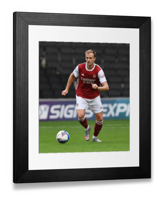 Framed Print : Arsenal's Rob Holding in Action: MK Dons vs Arsenal (2020-21) Pre-Season Friendly
