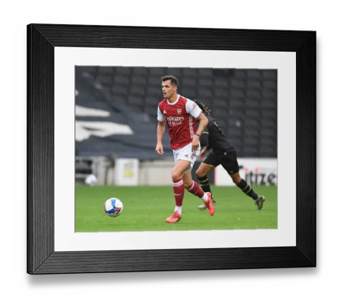 Framed Print : Granit Xhaka's Pre-Season Dominance: Arsenal's Victory over MK Dons (2020-21) Framed Print : Granit Xhaka's Pre-Season Dominance: Arsenal's Victory over MK Dons (2020-21)