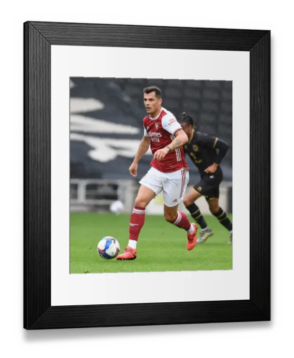 Framed Print : Granit Xhaka in Action: Arsenal's Pre-Season Victory over MK Dons (2020-21)