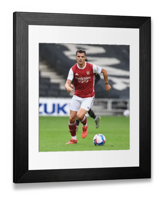 Framed Print : Granit Xhaka's Pre-Season Dominance: Arsenal's Victory over MK Dons, 2020