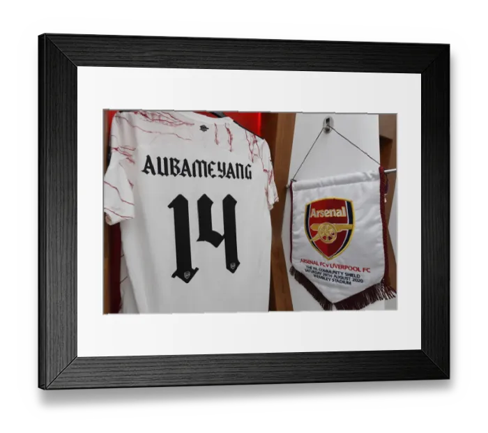 Framed Print : Arsenal Captain Aubameyang's Shirt and Pennant in Changing Room before Arsenal vs Liverpool FA Community Shield 2020-21
