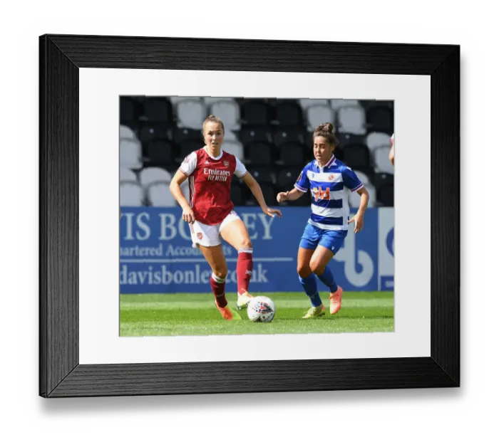 Framed Print : Arsenal vs Reading Women: Intense Battle in FA WSL Match