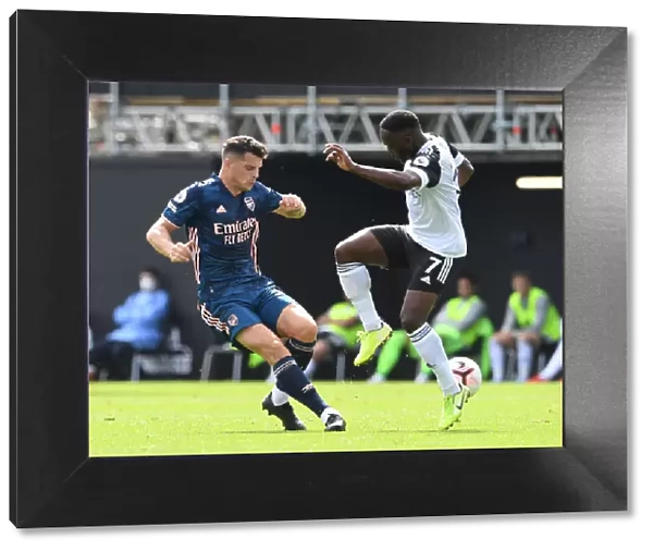 Xhaka vs Kebano: Intense Clash in Fulham vs Arsenal Premier League Match, 2020-21