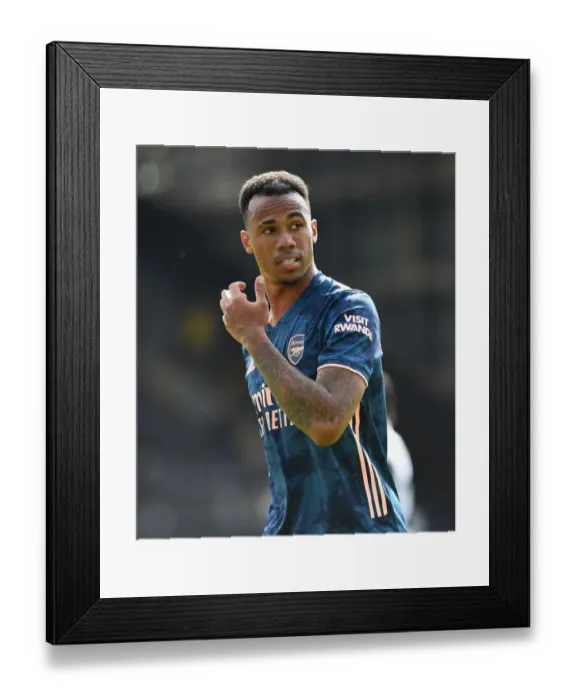 Framed Print : Gabriel Magalhaes Focuses in Arsenal's Victory over Fulham (Fulham vs Arsenal, 2020-21 Premier League)