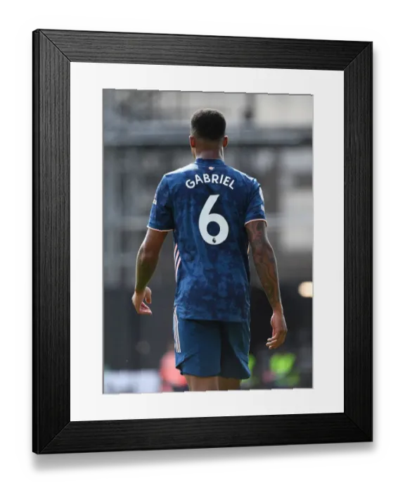 Framed Print : Gabriel Magalhaes Unwavering Concentration: Arsenal's Triumph over Fulham (Fulham vs Arsenal, 2020-21 Premier League)