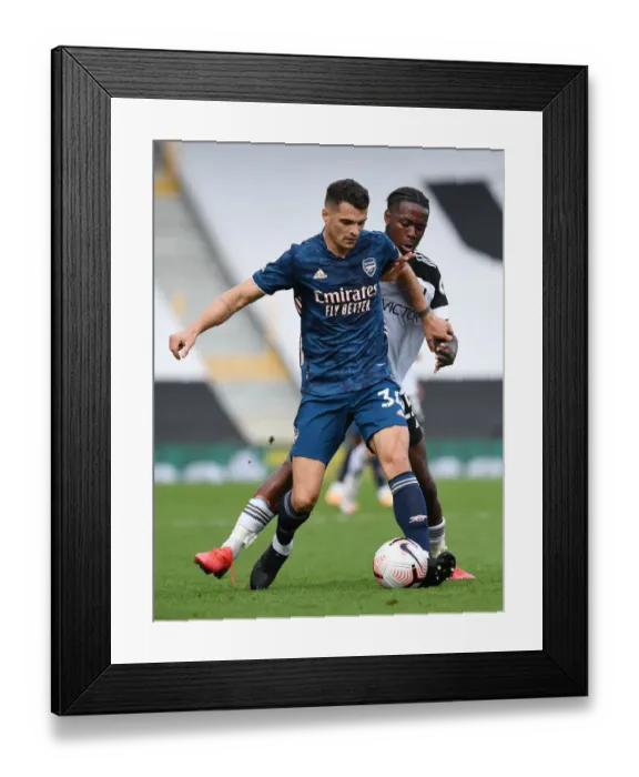 Framed Print : Xhaka vs Onomah: Intense Clash in Fulham vs Arsenal Premier League Encounter