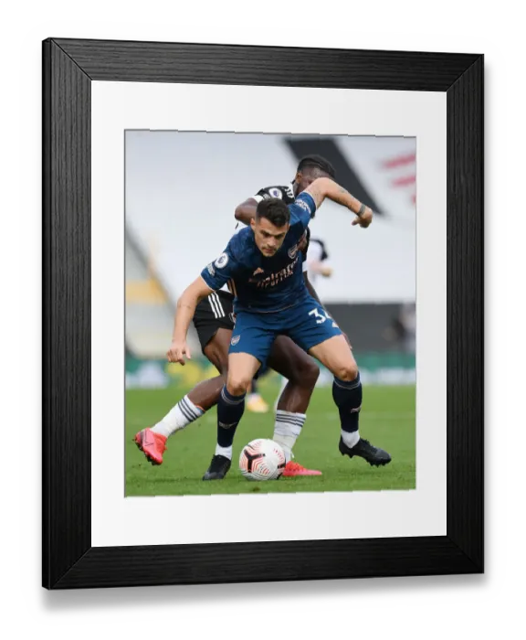 Framed Print : Xhaka vs Onomah: Intense Battle in Fulham vs Arsenal Premier League Clash