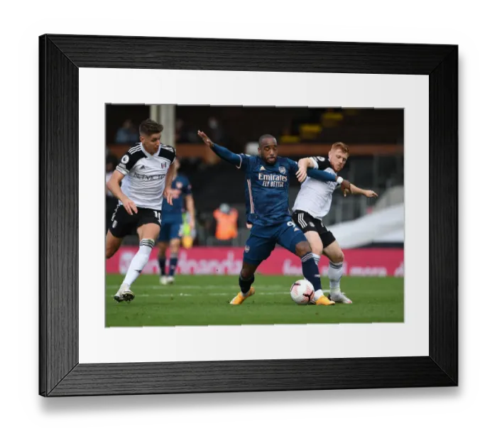 Framed Print : Fulham vs. Arsenal: Lacazette Faces Off Against Cairney and Reed in Premier League Clash