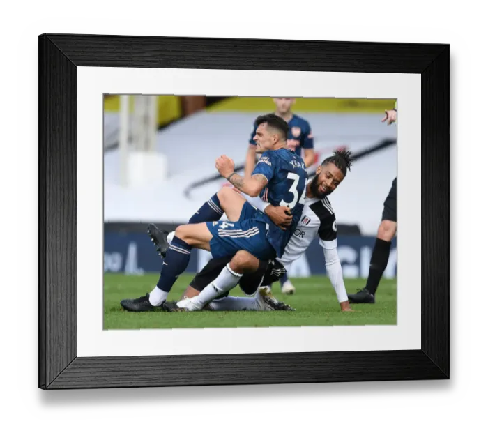 Framed Print : Xhaka vs Hector: Intense Battle in Fulham vs Arsenal Premier League Clash Framed Print : Xhaka vs Hector: Intense Battle in Fulham vs Arsenal Premier League Clash