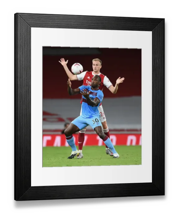 Framed Print : Arsenal vs. West Ham United: Rob Holding Clashes with Michail Antonio in Premier League Showdown Framed Print : Arsenal vs. West Ham United: Rob Holding Clashes with Michail Antonio in Premier League Showdown