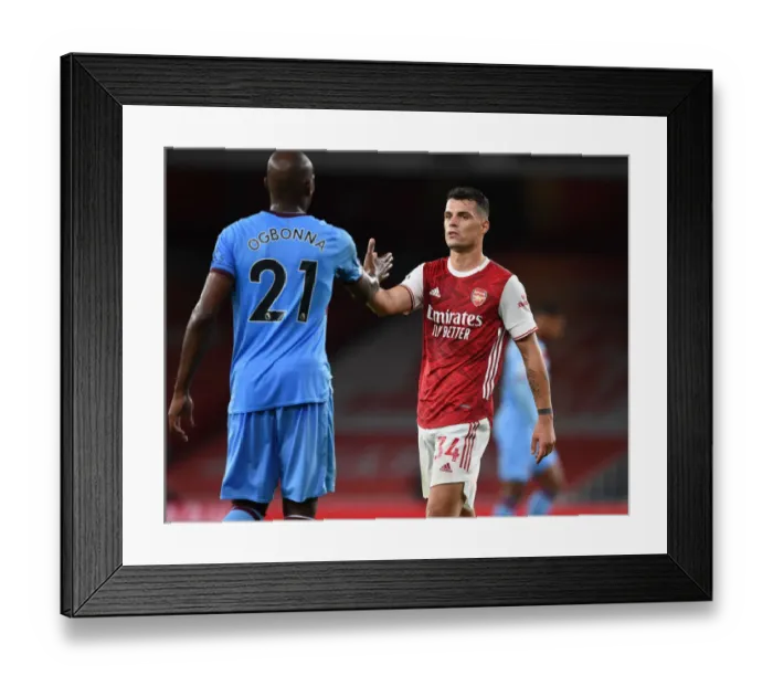 Framed Print : Arsenal vs. West Ham: Xhaka and Ogbonna Share a Moment after Premier League Clash