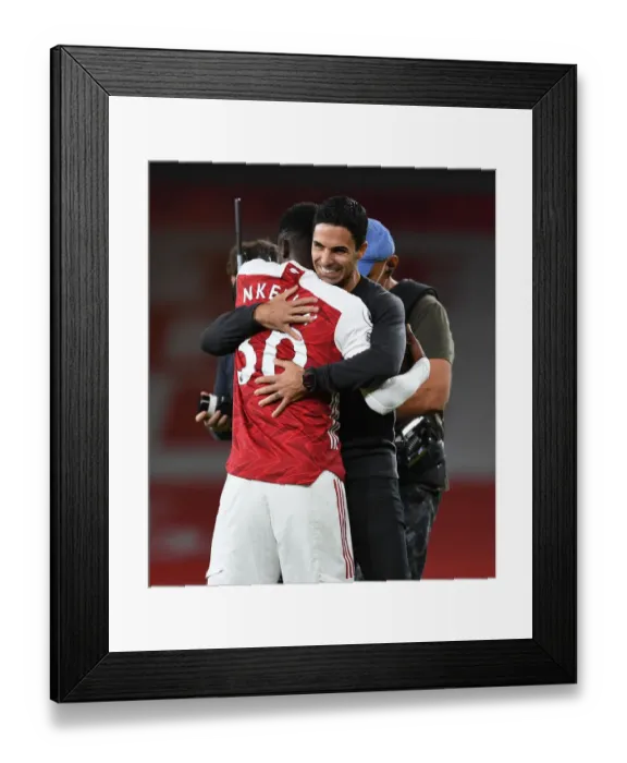 Framed Print : Arsenal's Eddie Nketiah Scores Winning Goal, Mikel Arteta Celebrates
