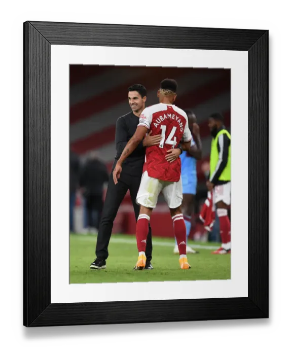 Framed Print : Arsenal's Victory: Arteta Embraces Aubameyang after Arsenal v West Ham United (2020-21)
