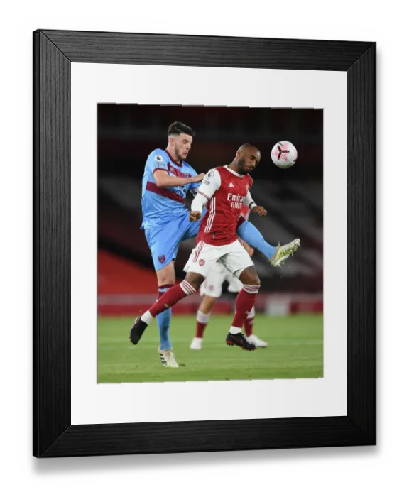 Framed Print : Arsenal vs. West Ham: Lacazette Heads Away from Rice in 2020-21 Premier League Clash Framed Print : Arsenal vs. West Ham: Lacazette Heads Away from Rice in 2020-21 Premier League Clash