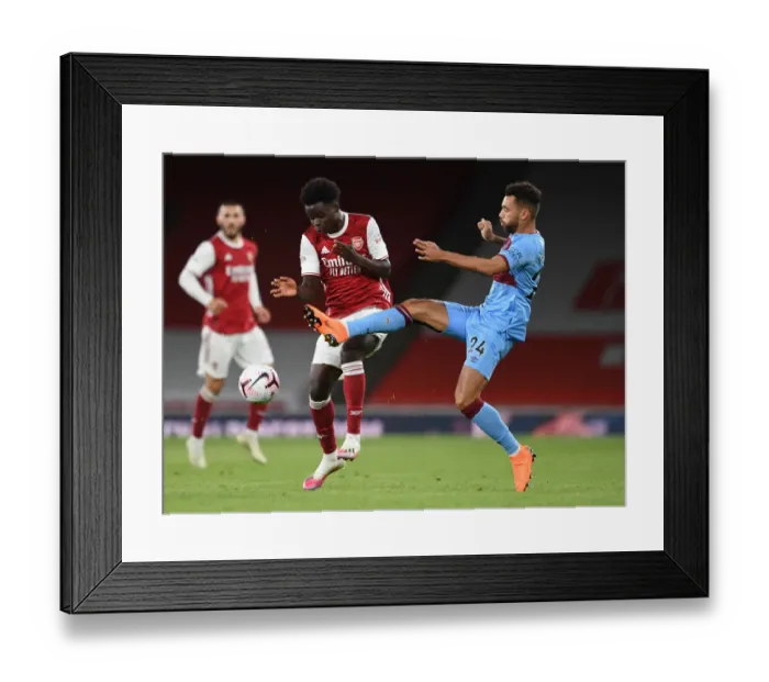 Framed Print : Arsenal vs. West Ham: Saka Fouls Mar Red-Hot Premier League Clash Framed Print : Arsenal vs. West Ham: Saka Fouls Mar Red-Hot Premier League Clash