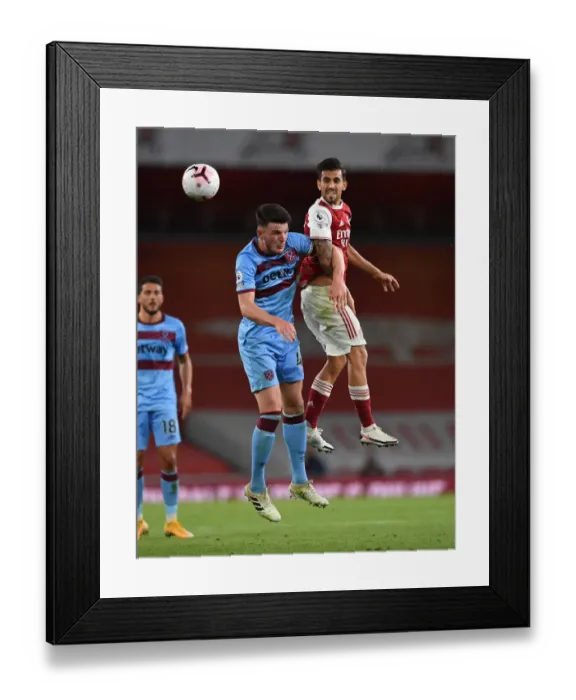 Framed Print : Arsenal vs. West Ham: Ceballos Faces Off Against Rice in Intense Premier League Clash
