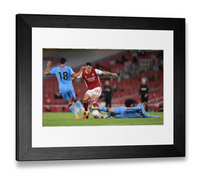 Framed Print : Arsenal vs. West Ham United: Xhaka Faces Off Against Fornals and Bowen