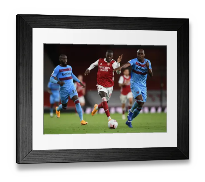 Framed Print : Pepe vs Ogbonna: Intense Battle in Arsenal vs West Ham Premier League Clash