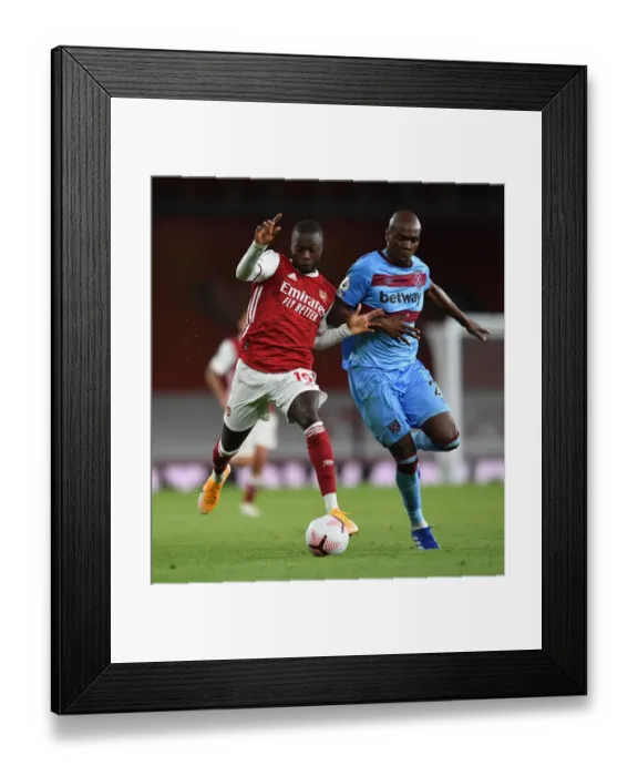 Framed Print : Arsenal's Pepe Clashes with West Ham's Ogbonna in Premier League Showdown Framed Print : Arsenal's Pepe Clashes with West Ham's Ogbonna in Premier League Showdown