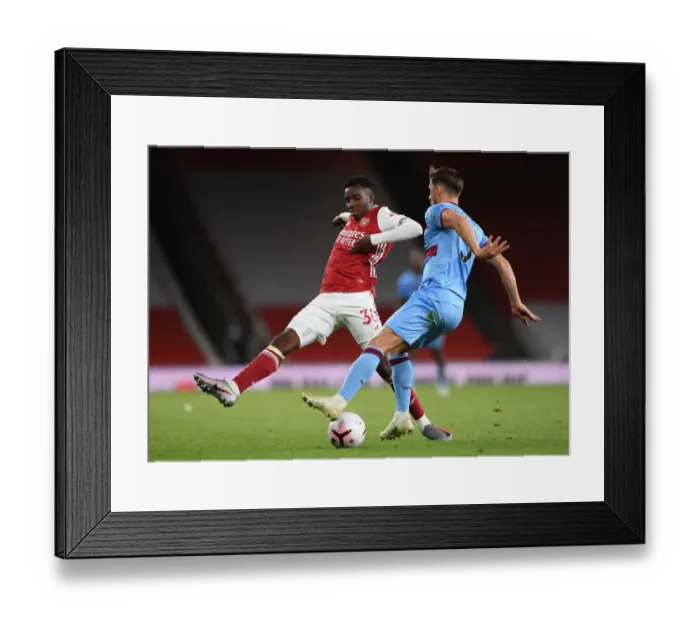 Framed Print : Arsenal's Eddie Nketiah Closes In on West Ham's Aaron Creswell in Intense Arsenal v West Ham United Premier League Clash Framed Print : Arsenal's Eddie Nketiah Closes In on West Ham's Aaron Creswell in Intense Arsenal v West Ham United Premier League Clash