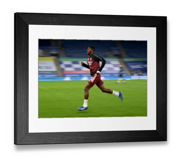 Framed Print : Arsenal's Ainsley Maitland-Niles Warming Up Ahead of Leicester City Carabao Cup Clash