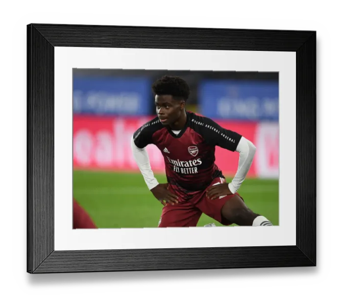 Framed Print : Arsenal's Bukayo Saka Prepares for Carabao Cup Clash Against Leicester City Framed Print : Arsenal's Bukayo Saka Prepares for Carabao Cup Clash Against Leicester City