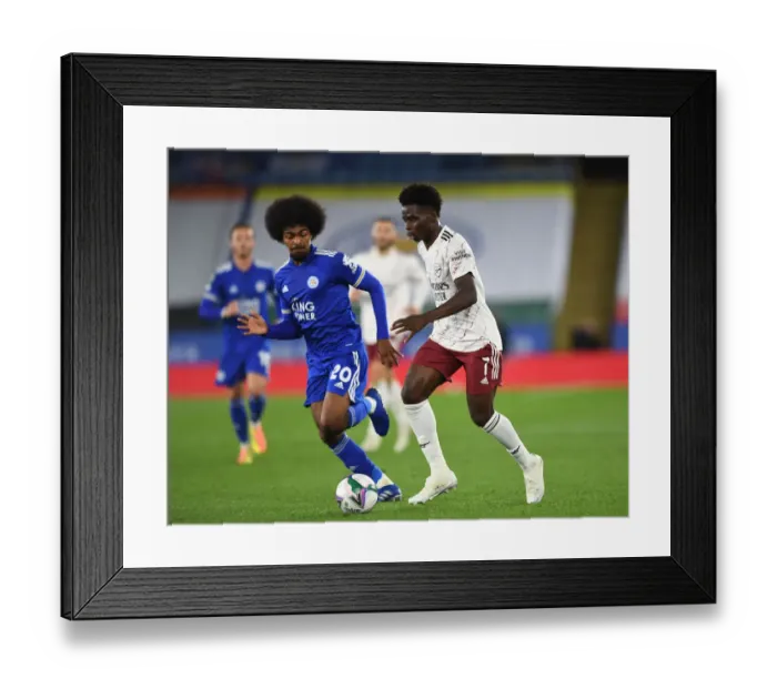 Framed Print : Saka vs Choudhury: A Young Gun's Battle against the Midfield Titan in Arsenal's Carabao Cup Clash