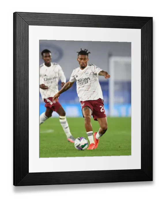 Framed Print : Arsenal's Reiss Nelson Goes Head-to-Head with Leicester City in Carabao Cup Clash