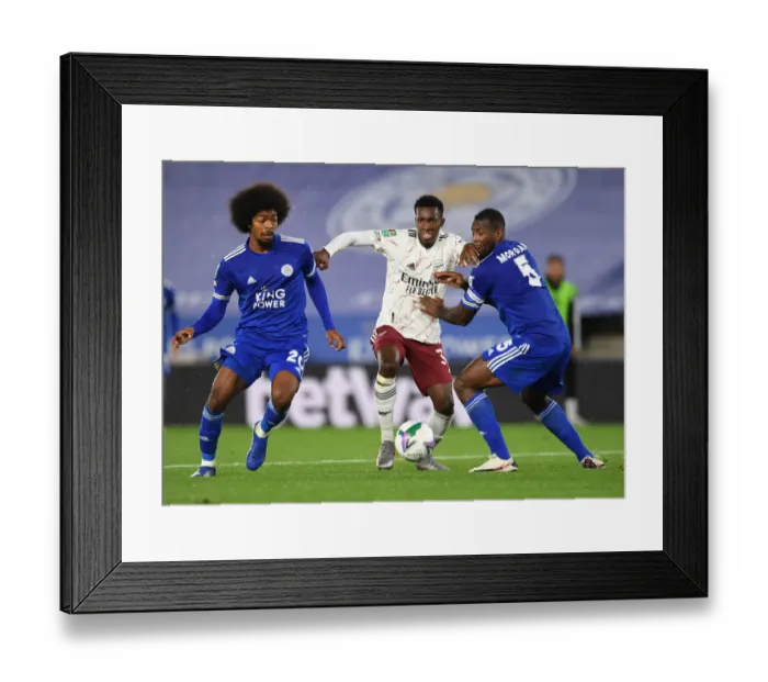 Framed Print : Arsenal's Nketiah Clashes with Leicester's Choudhury and Morgan in Carabao Cup Showdown