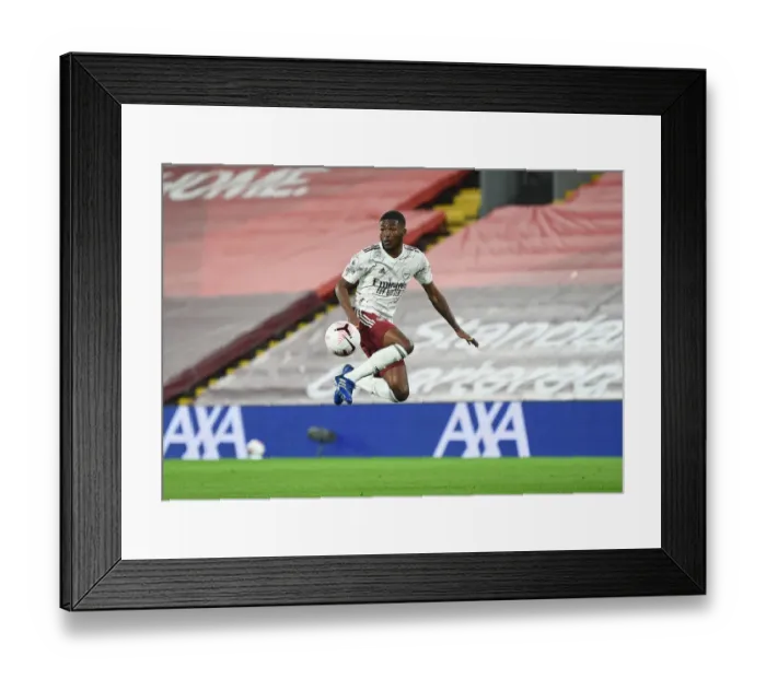 Framed Print : Empty Anfield: Ainsley Maitland-Niles in Action for Arsenal vs Liverpool, 2020-21 Premier League Framed Print : Empty Anfield: Ainsley Maitland-Niles in Action for Arsenal vs Liverpool, 2020-21 Premier League