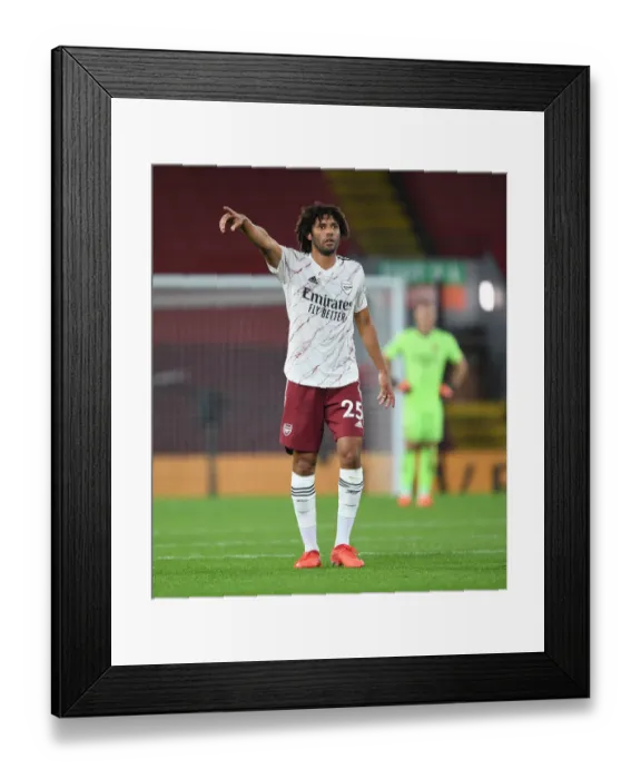 Framed Print : A Lone Arsenal Warrior at Anfield: Mo Elneny Amidst Empty Stands - Premier League 2020-21