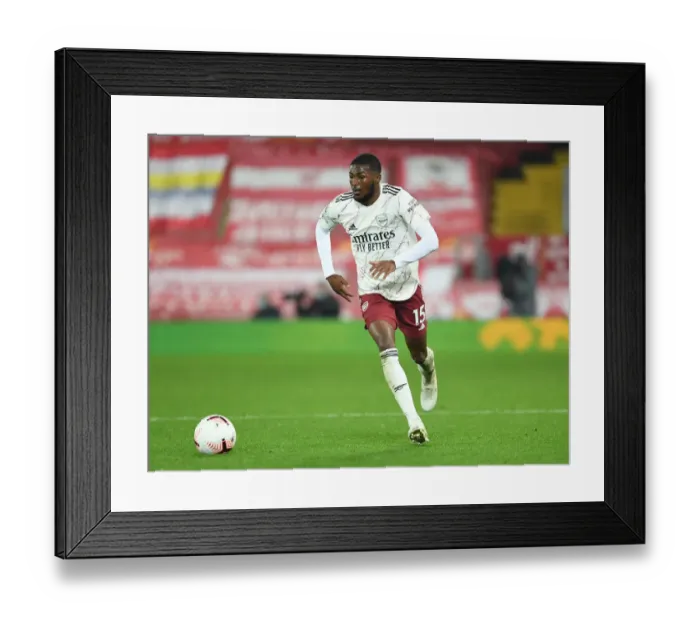 Framed Print : Arsenal's Ainsley Maitland-Niles at Empty Anfield, 2020-21 Premier League Framed Print : Arsenal's Ainsley Maitland-Niles at Empty Anfield, 2020-21 Premier League