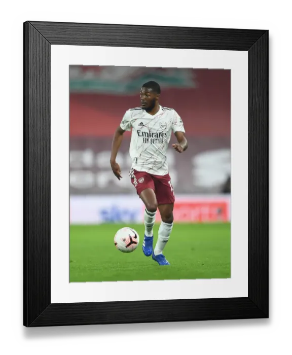 Framed Print : Arsenal's Ainsley Maitland-Niles at Empty Anfield, 2020-21 Premier League Framed Print : Arsenal's Ainsley Maitland-Niles at Empty Anfield, 2020-21 Premier League
