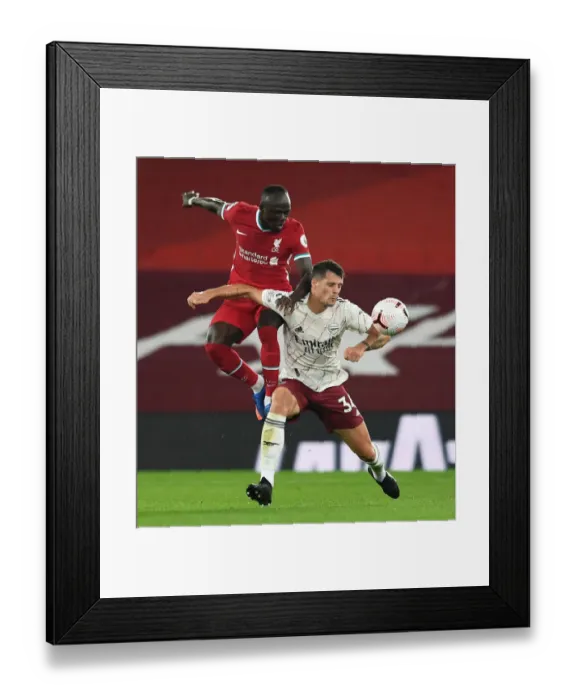 Framed Print : Xhaka vs Mane: Liverpool vs Arsenal Clash in Empty Anfield, Premier League 2020-21