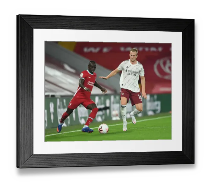 Framed Print : Rivalry Restarted: Holding Holds Off Mane in Empty Anfield