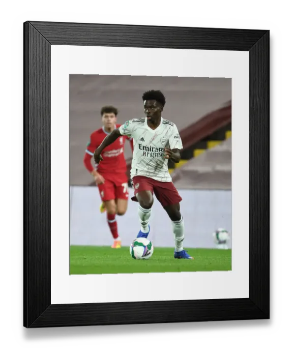 Framed Print : Arsenal's Bukayo Saka in Action against Liverpool in Empty Anfield - Carabao Cup 2020-21