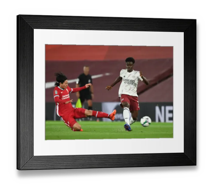 Framed Print : Bukayo Saka vs. Takumi Minamino: Empty Anfield Rivalry - Carabao Cup 2020-21