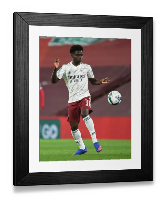 Framed Print : Arsenal's Bukayo Saka at Empty Anfield: Carabao Cup Showdown Against Liverpool, 2020 Framed Print : Arsenal's Bukayo Saka at Empty Anfield: Carabao Cup Showdown Against Liverpool, 2020