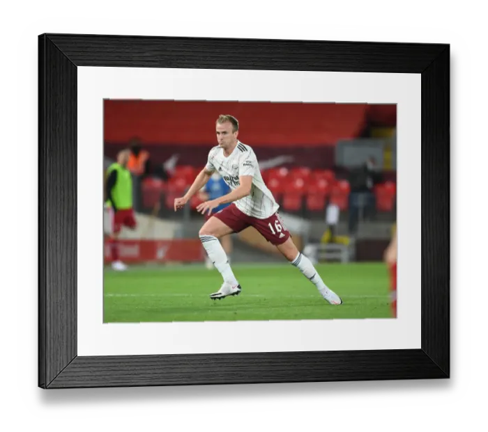 Framed Print : Arsenal's Rob Holding at Empty Anfield: Carabao Cup Clash Against Liverpool