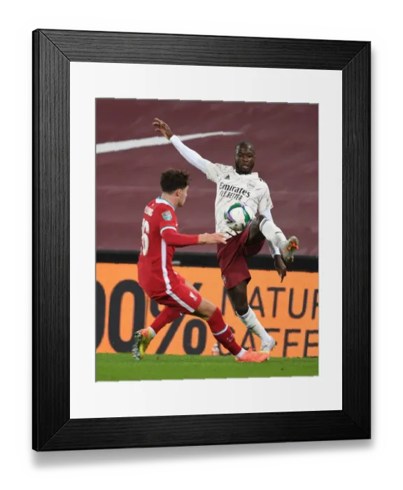 Framed Print : Pepe Breaks Through: Empty Anfield Rivalry - Liverpool vs. Arsenal, Carabao Cup 2020-21