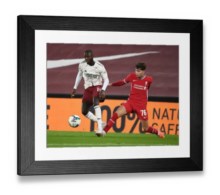 Framed Print : Pepe Breaks Through Empty Anfield: Arsenal vs. Liverpool in Carabao Cup Showdown Framed Print : Pepe Breaks Through Empty Anfield: Arsenal vs. Liverpool in Carabao Cup Showdown