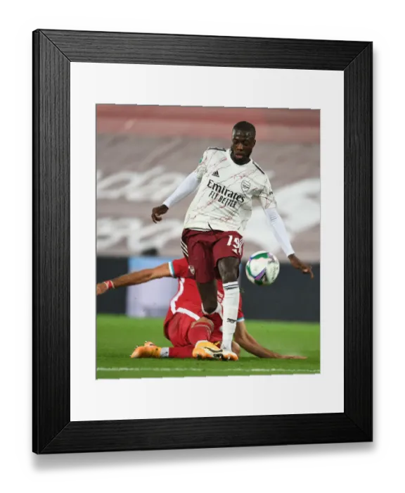 Framed Print : Empty Anfield Showdown: Pepe Leads Arsenal Against Liverpool in Carabao Cup Amidst Coronavirus Pandemic Framed Print : Empty Anfield Showdown: Pepe Leads Arsenal Against Liverpool in Carabao Cup Amidst Coronavirus Pandemic