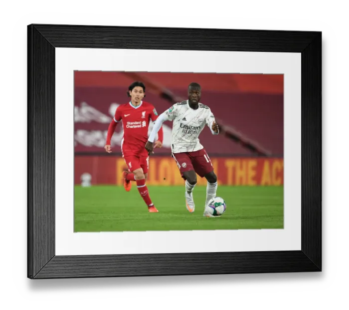 Framed Print : Empty Anfield Showdown: Nicolas Pepe Faces Liverpool in Carabao Cup Amidst Pandemic Framed Print : Empty Anfield Showdown: Nicolas Pepe Faces Liverpool in Carabao Cup Amidst Pandemic