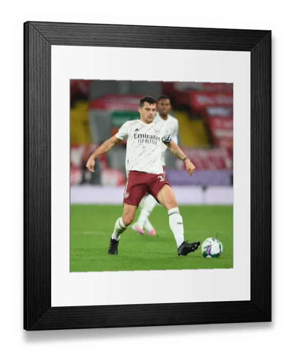 Framed Print : Arsenal's Granit Xhaka at Empty Anfield: Carabao Cup Clash vs. Liverpool, 2020