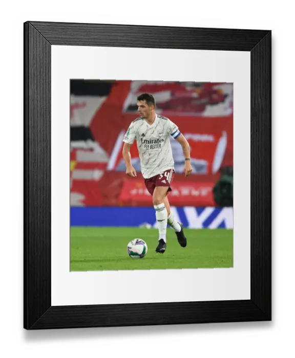 Framed Print : Empty Anfield: Granit Xhaka Leads Arsenal Against Liverpool in Carabao Cup
