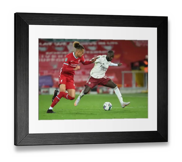 Framed Print : Pepe Breaks Through: Arsenal's Thrilling Victory at Empty Anfield in Carabao Cup Clash (Arsenal vs. Liverpool)